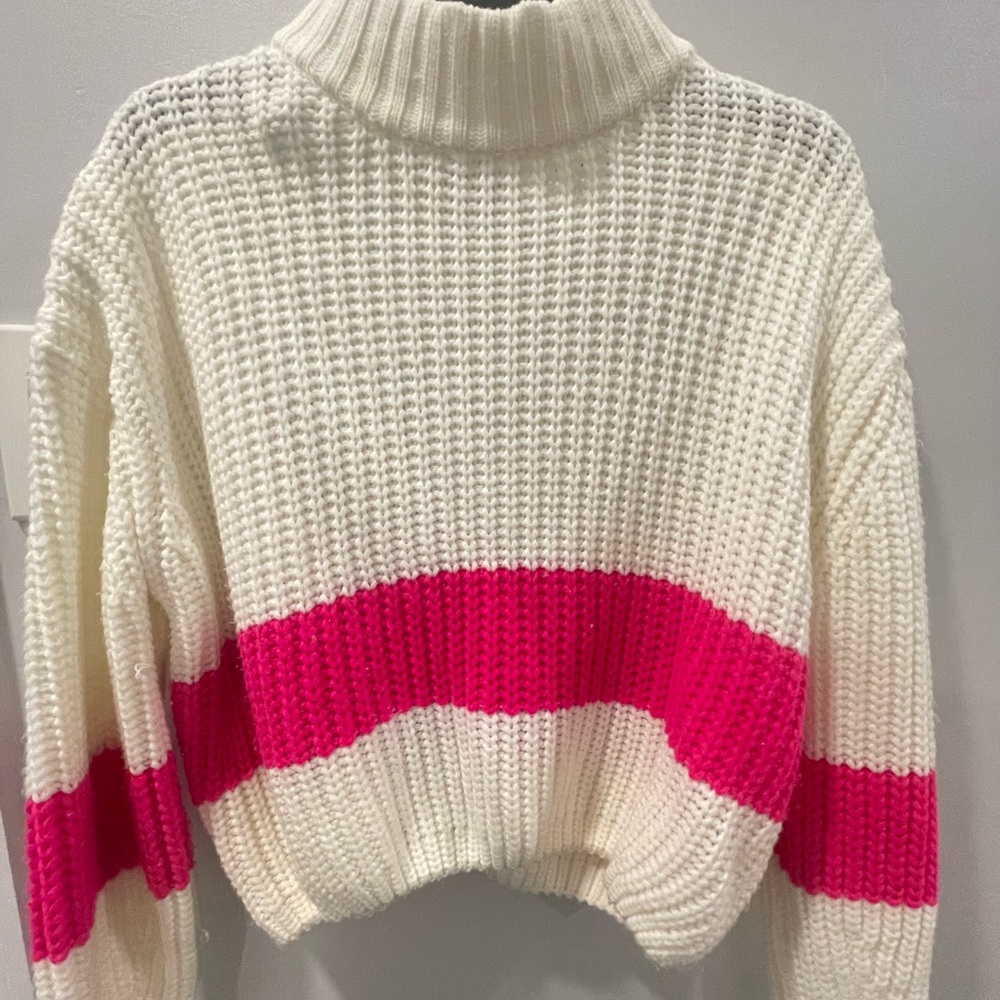 cream and hot pink color-block turtleneck sweater